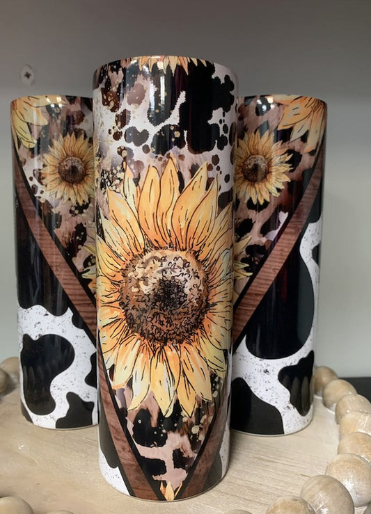 Sunflower Cow Tumbler 20 oz tumbler. made for hot or cold beverages. Hand wash only individually boxed with the lid and straw.   Made In: USA  Dimensions (inch):  One Size: 8.5 (Length), 2.5 (Width), 2.5 (Height)